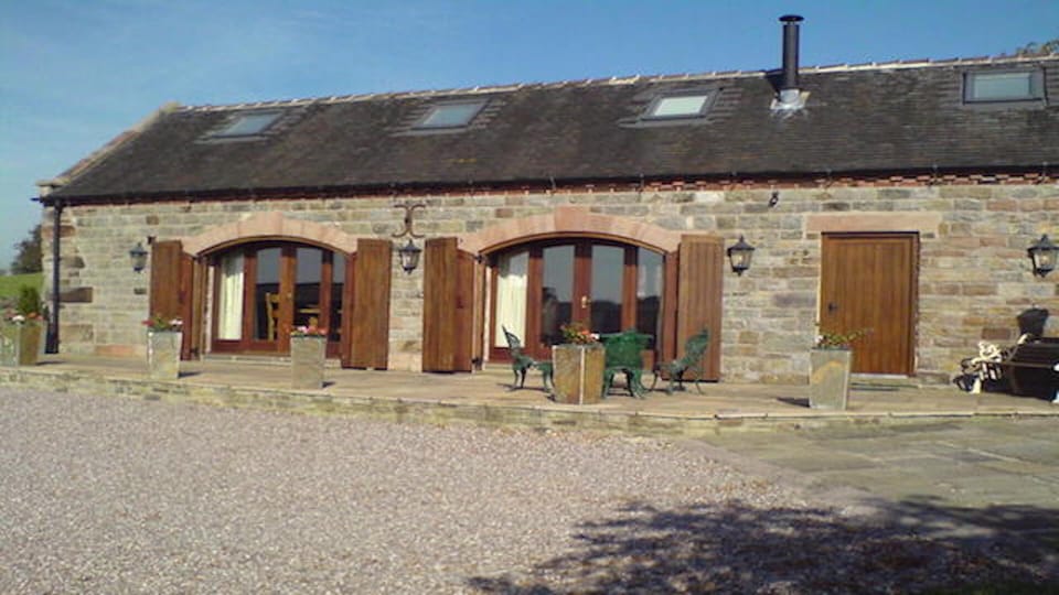 detached contemporary barn that nestles on a delightful south facing hillside