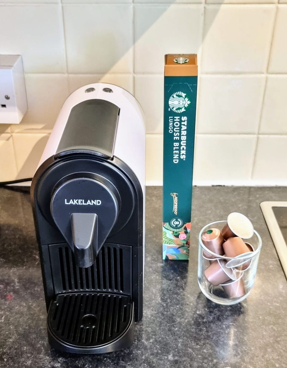 Nespresso Lakeland pod coffee machine, with some pods provided for your stay.
