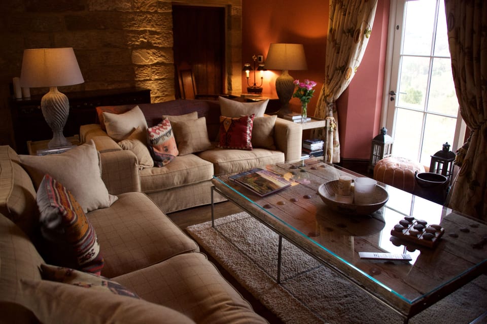 Comfortable sitting room with log burning stove.