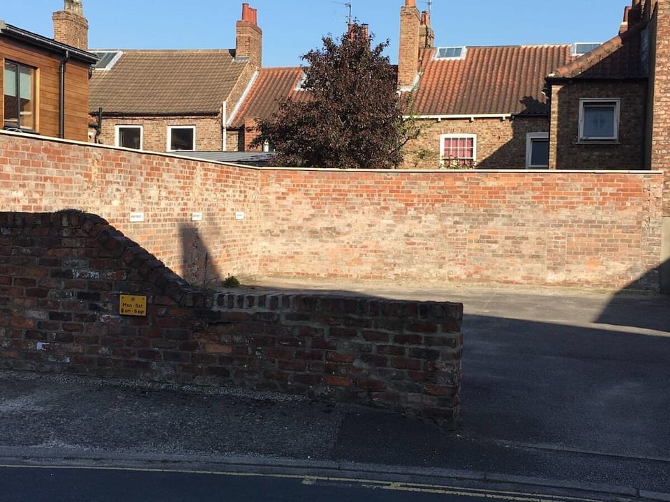 Parking to the back of the apartment building with private dedicated space 
