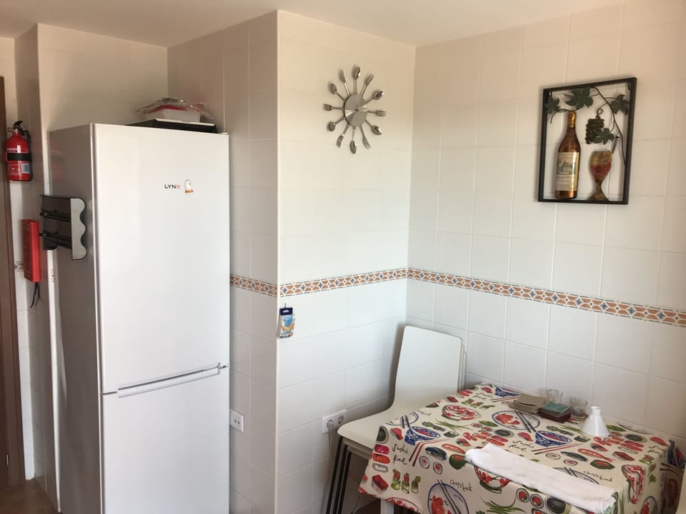 Fridge freezer with extending table