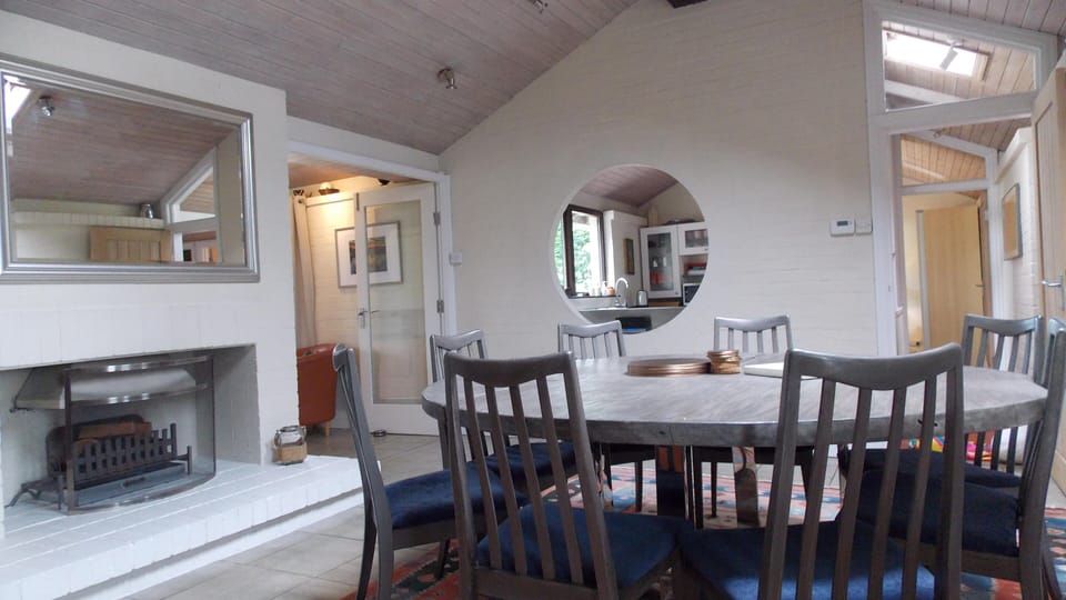 Large dining room with open log fire
