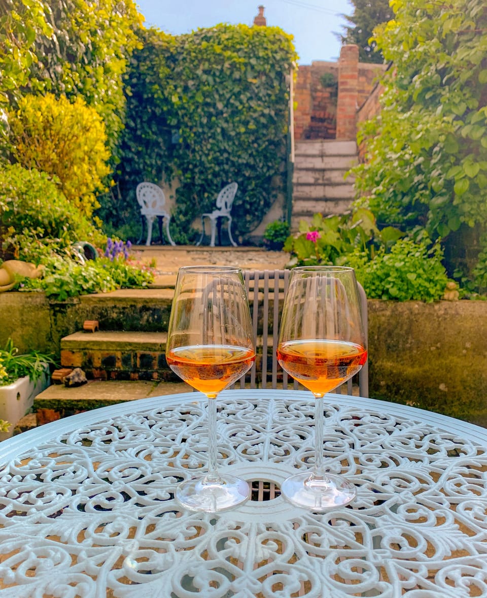 Sheltered, enclosed garden. A glass of wine, perhaps?