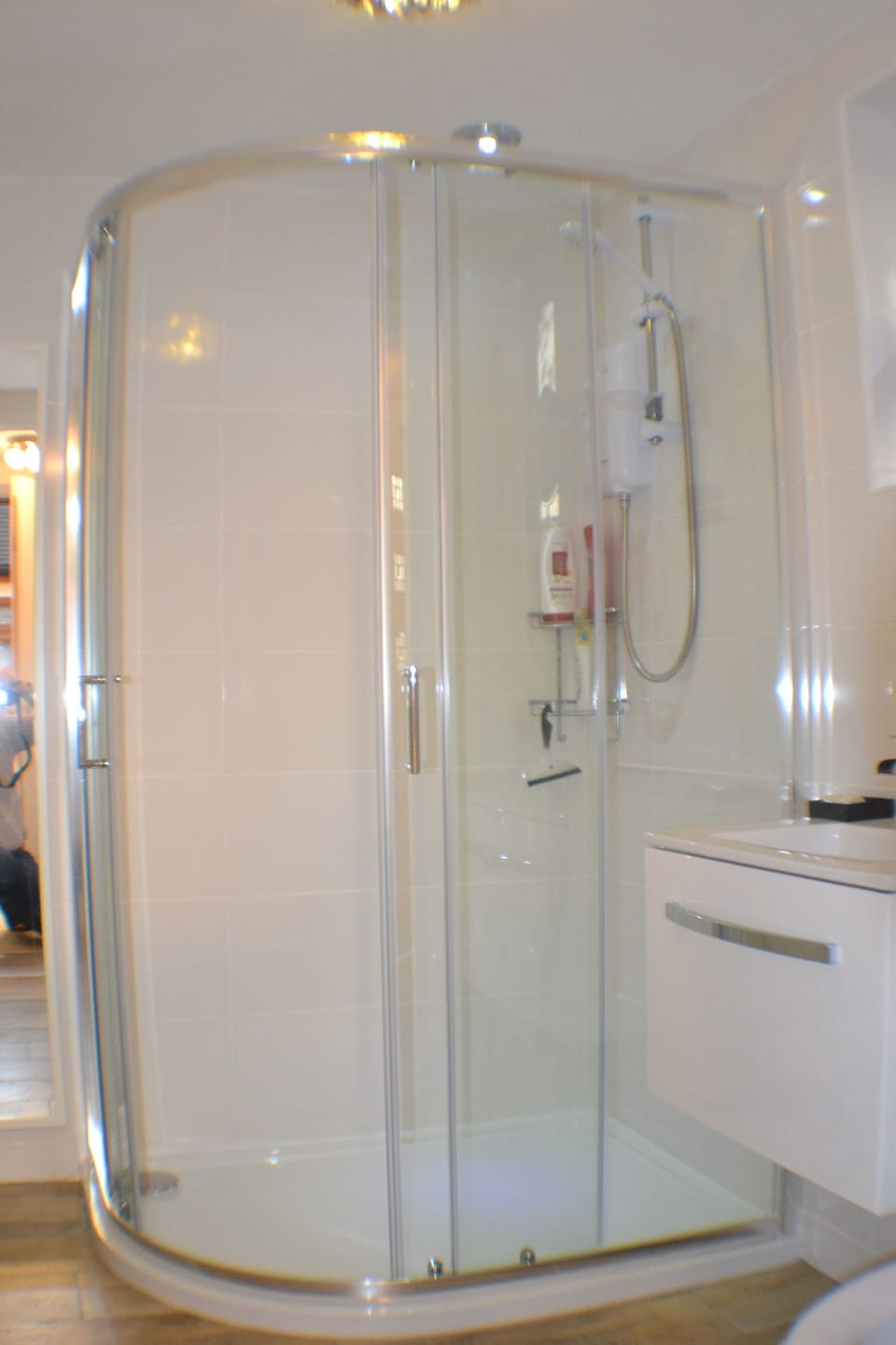 Full sized bathroom with shower