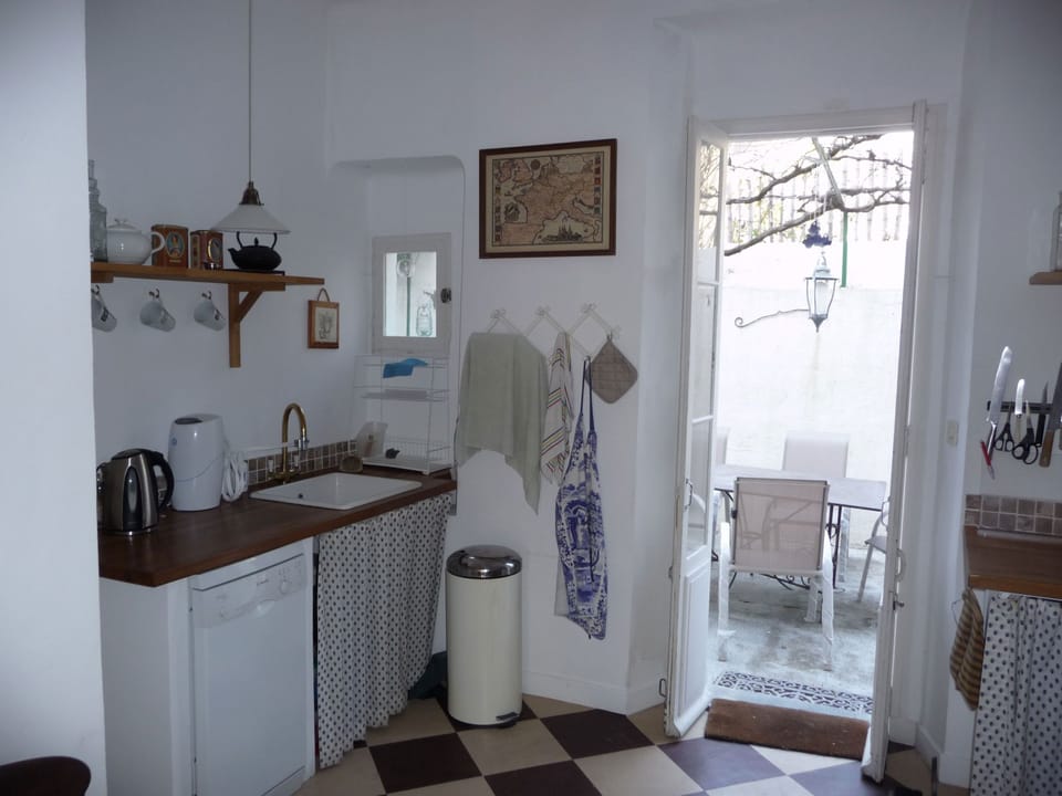 Large kitchen opening on to the lower terrace