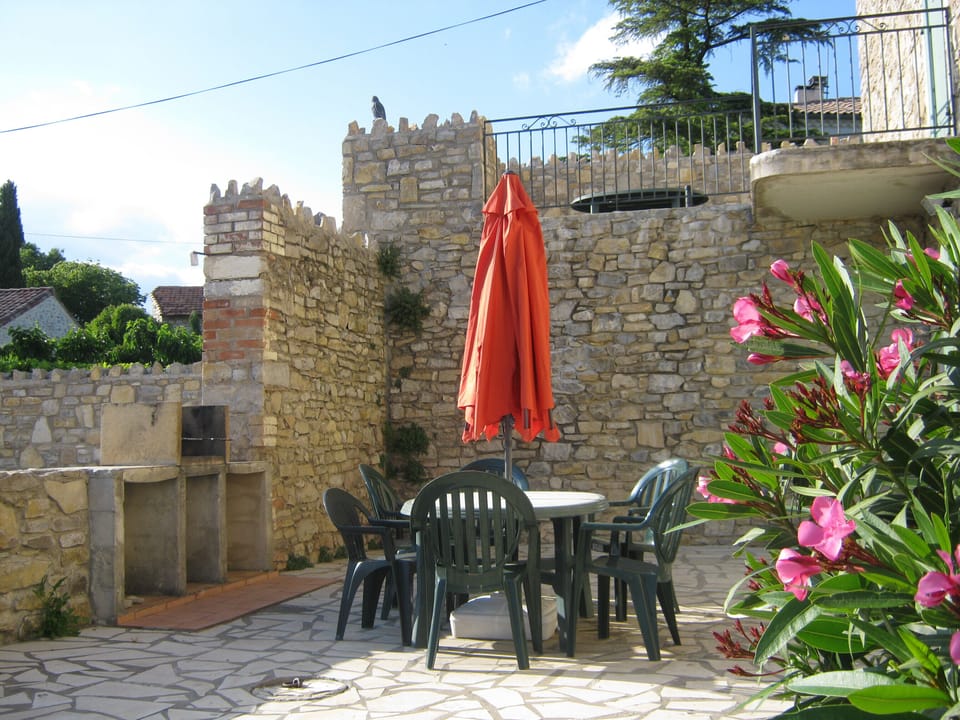 Large terrace with seating and barbecue area