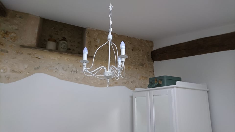 Chandelier lighting from the vaulted ceiling in the ensuite bedroom