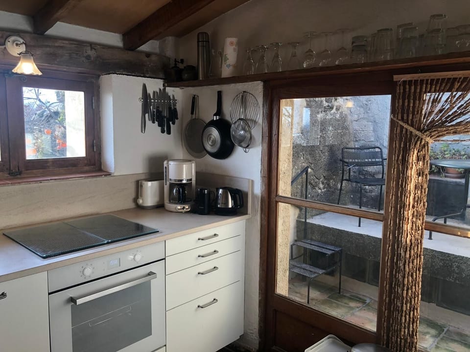 Kitchen showing small sheltered terrace  that gets good sun