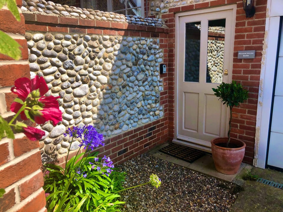 Front door to barn with parking directly outside.