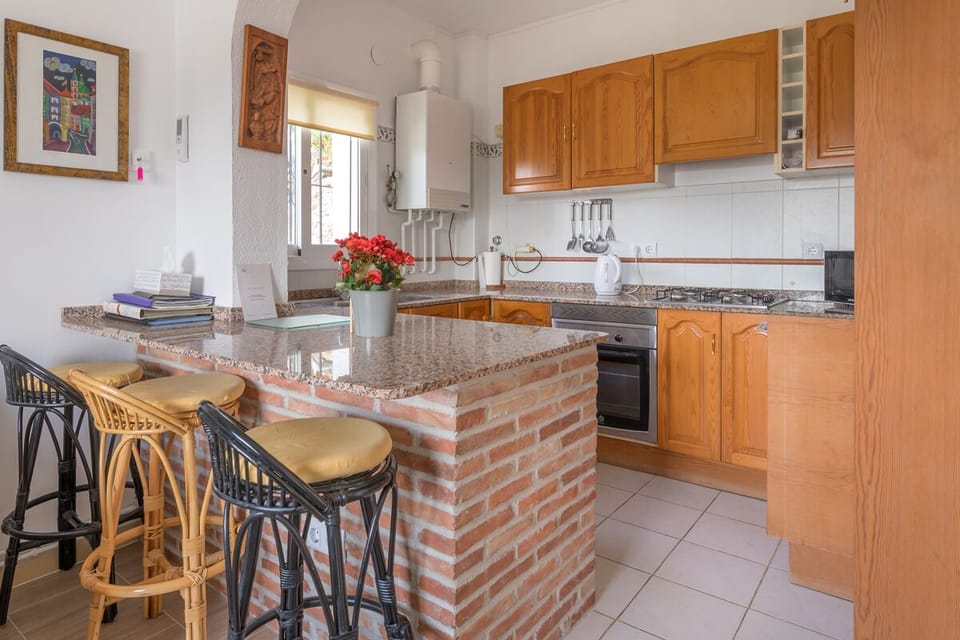 Your well equipped kitchen and breakfast bar