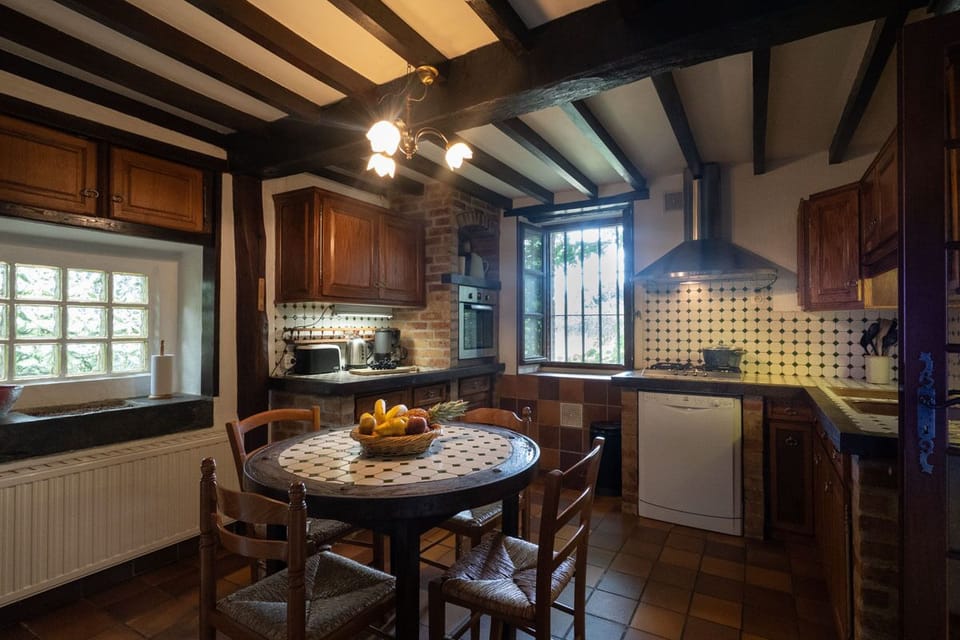 Dining kitchen featuring table made from a cart wheel!