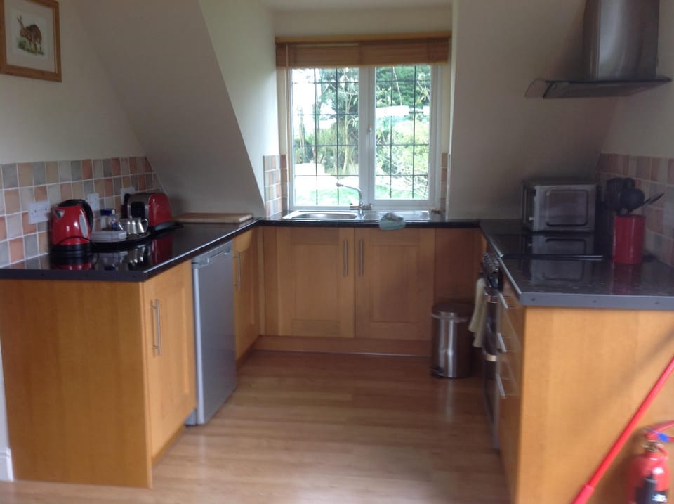 Fully equipped kitchen with a nice view over the fields