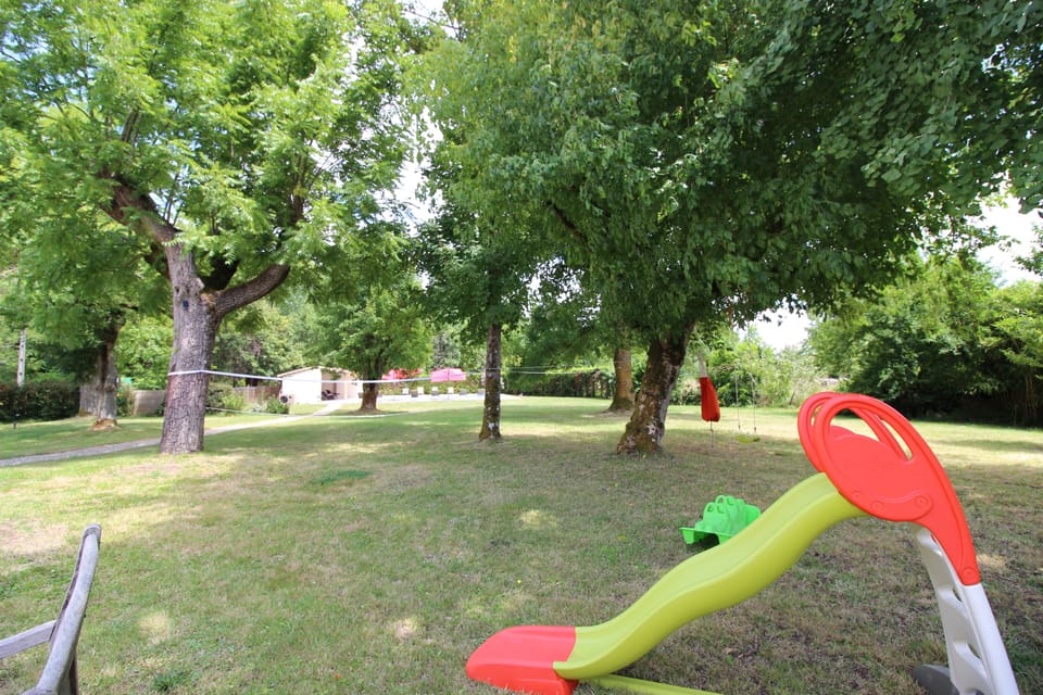 Play equipment for children includes slide, swing, sea-saw and climbing rope.