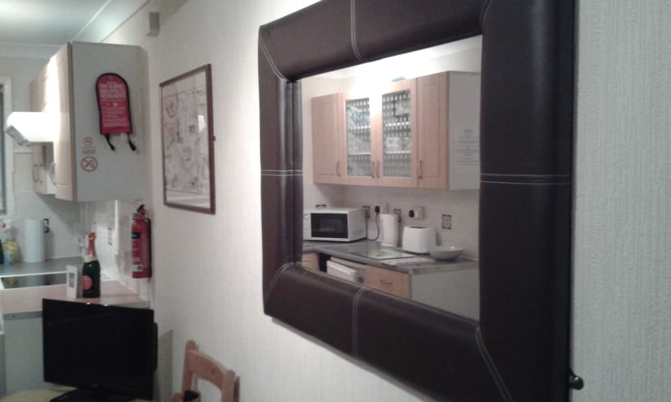 Open plan kitchen with lounge. 