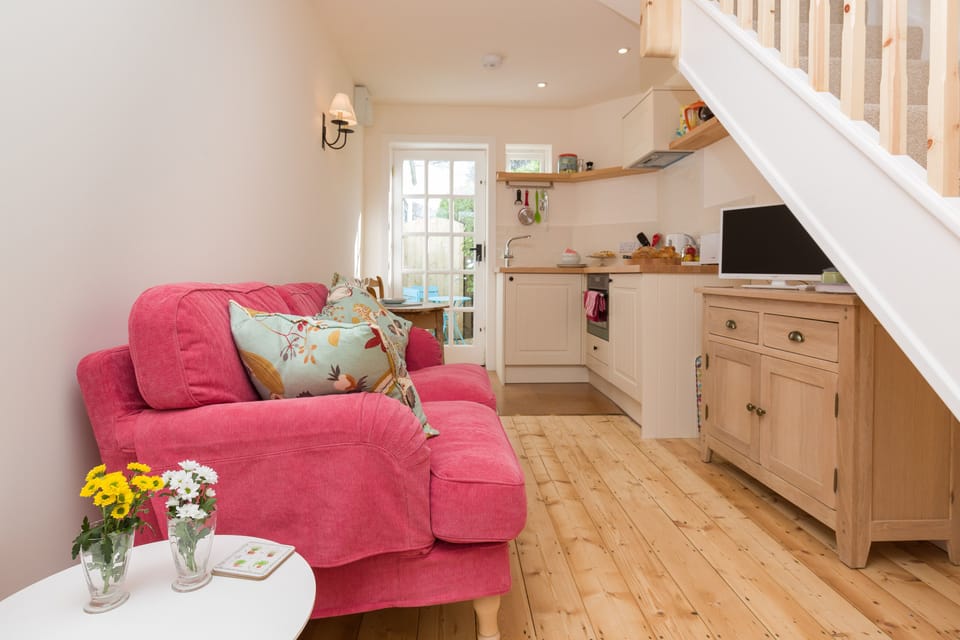 The inviting living room has a comfortable sofa 