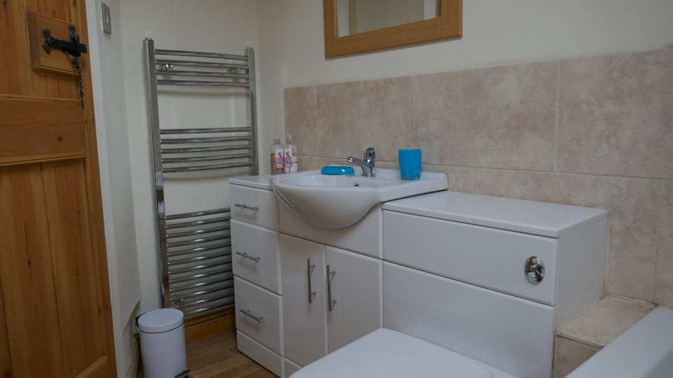 New bathroom with heated towel rail.