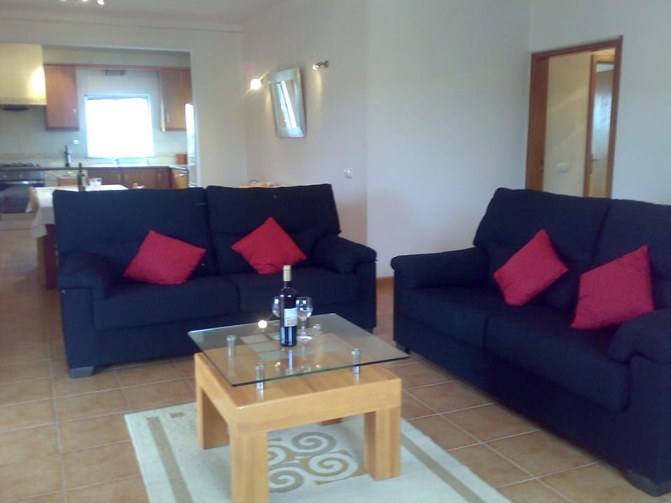 Spacious lounge with two comfy 3 seater settees