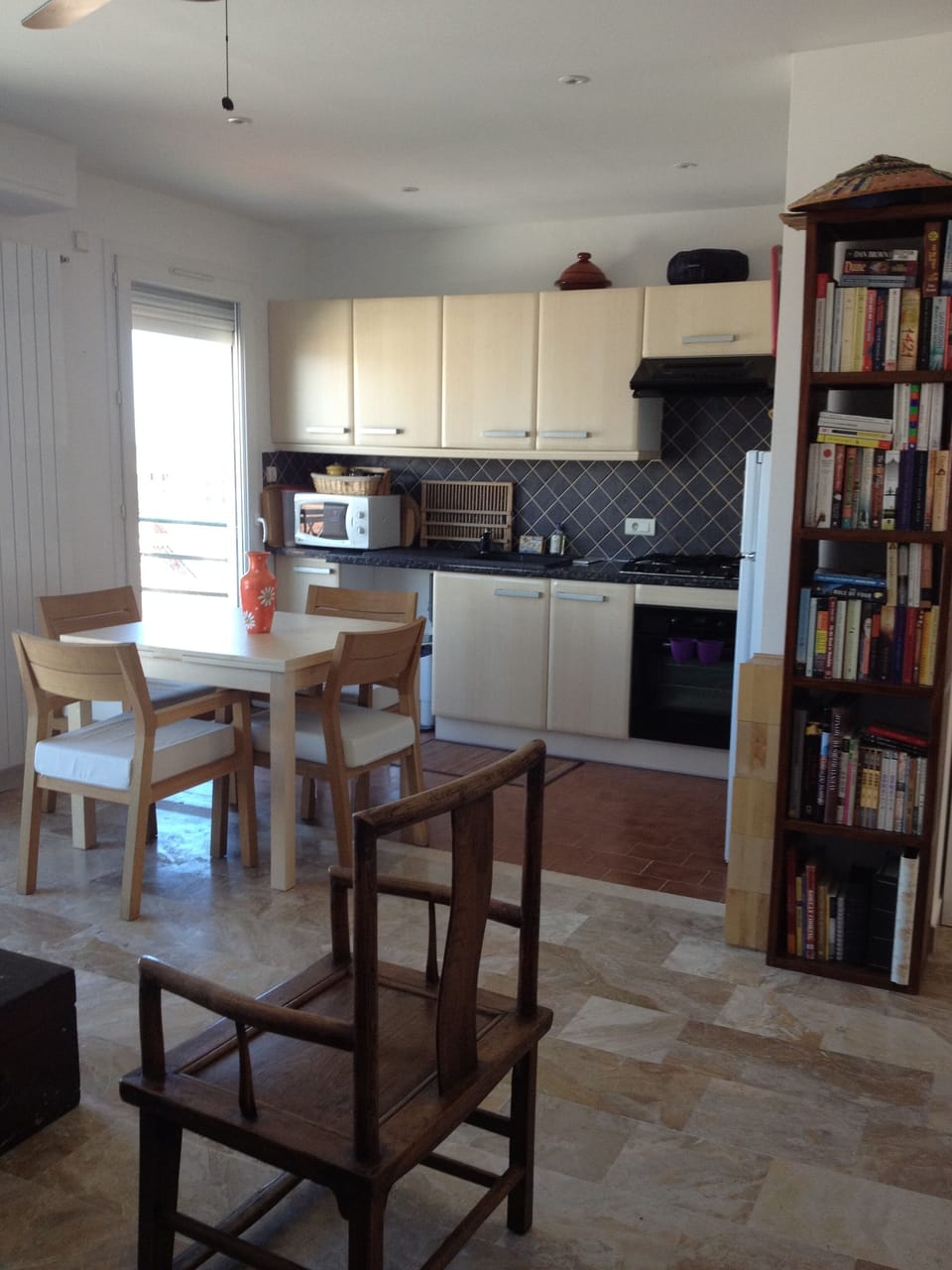 Kitchen and living room open to the balcony