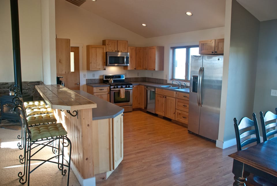 The Kitchen is equipped with stainless steel appliances and a gas stovetop.