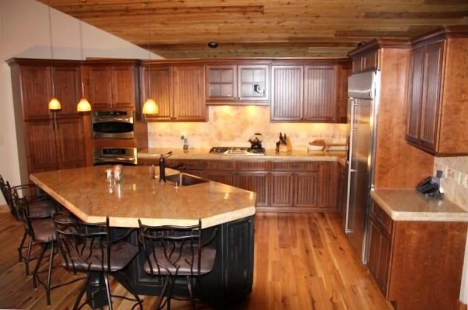 Granite counters, cherry wood cabinets, and microwave works as a second oven