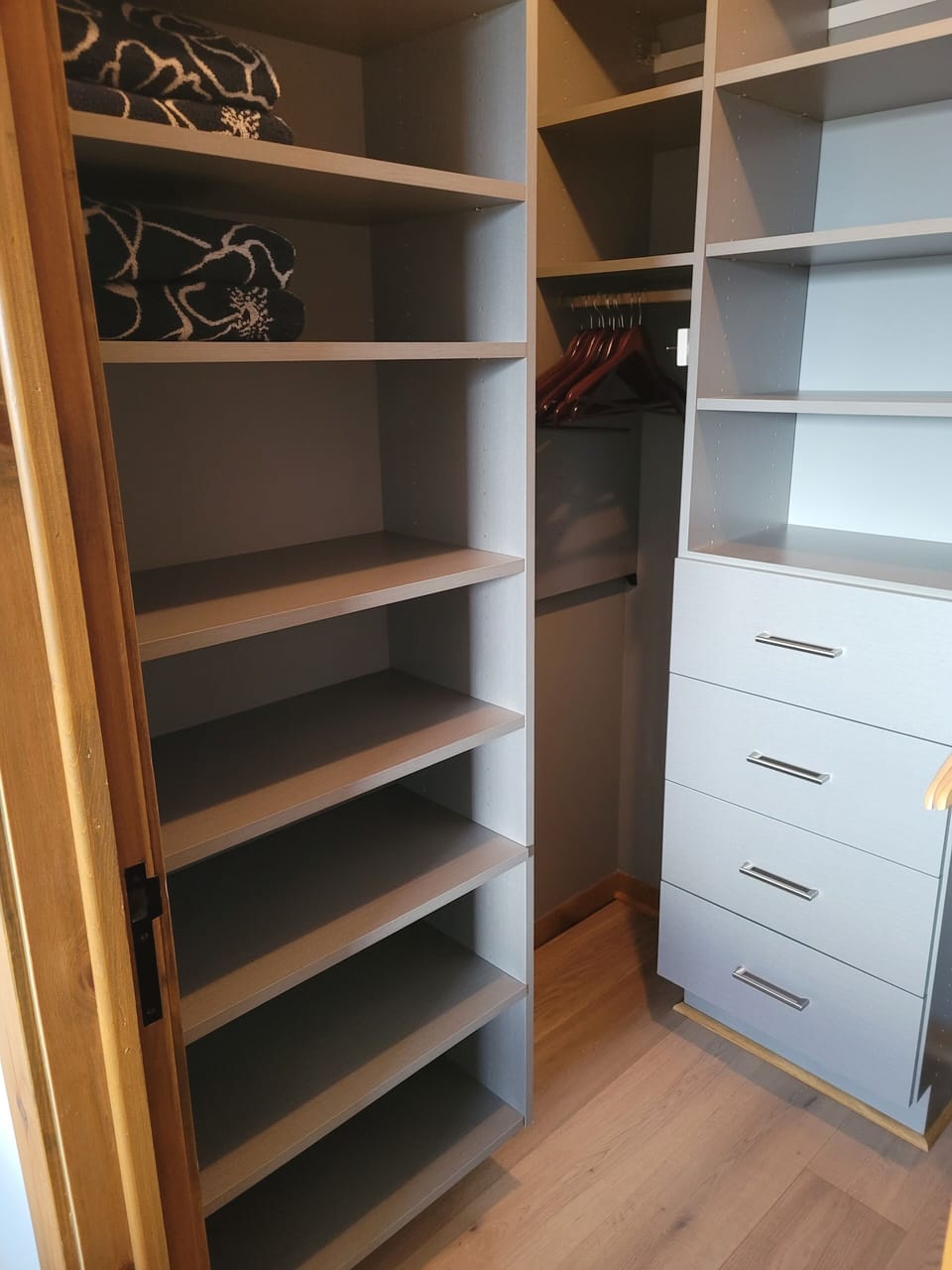 Master bedroom walk-in closet. Custom cabinetry.