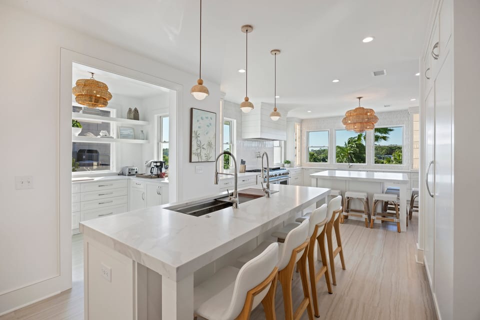 Center island with sink and prep kitchen