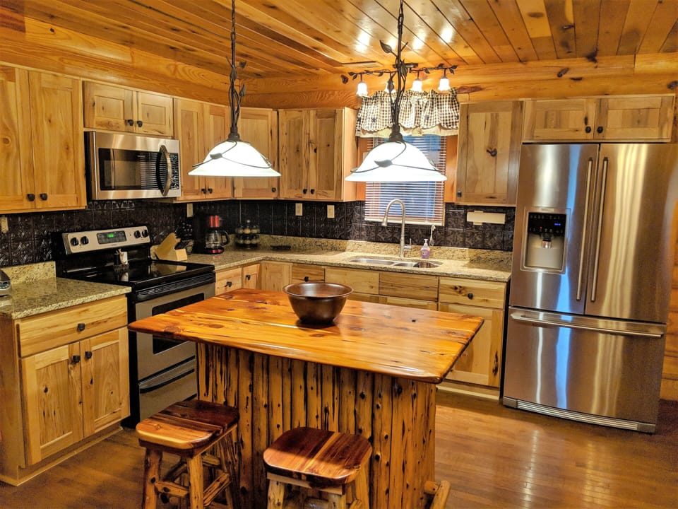 Brand new luxury kitchen with knotty hickory cabinets and granite coutertops.