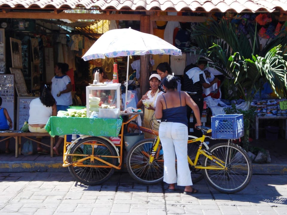 Many sidewalk vendors in town. Fresh fruits, juices & coconuts.