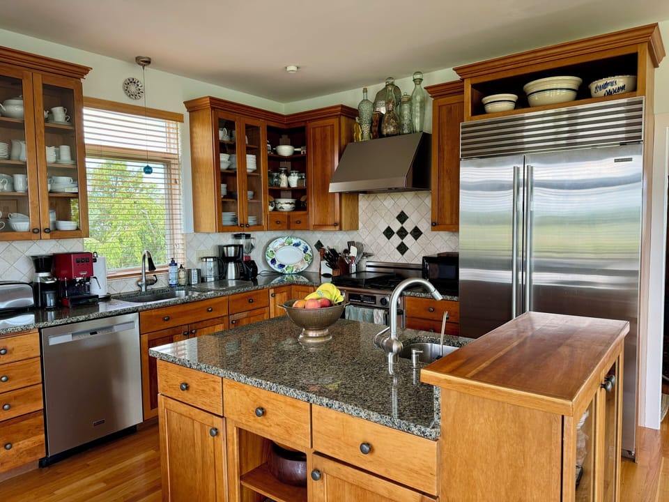 Gourmet kitchen with granite counters and cherry cabinets