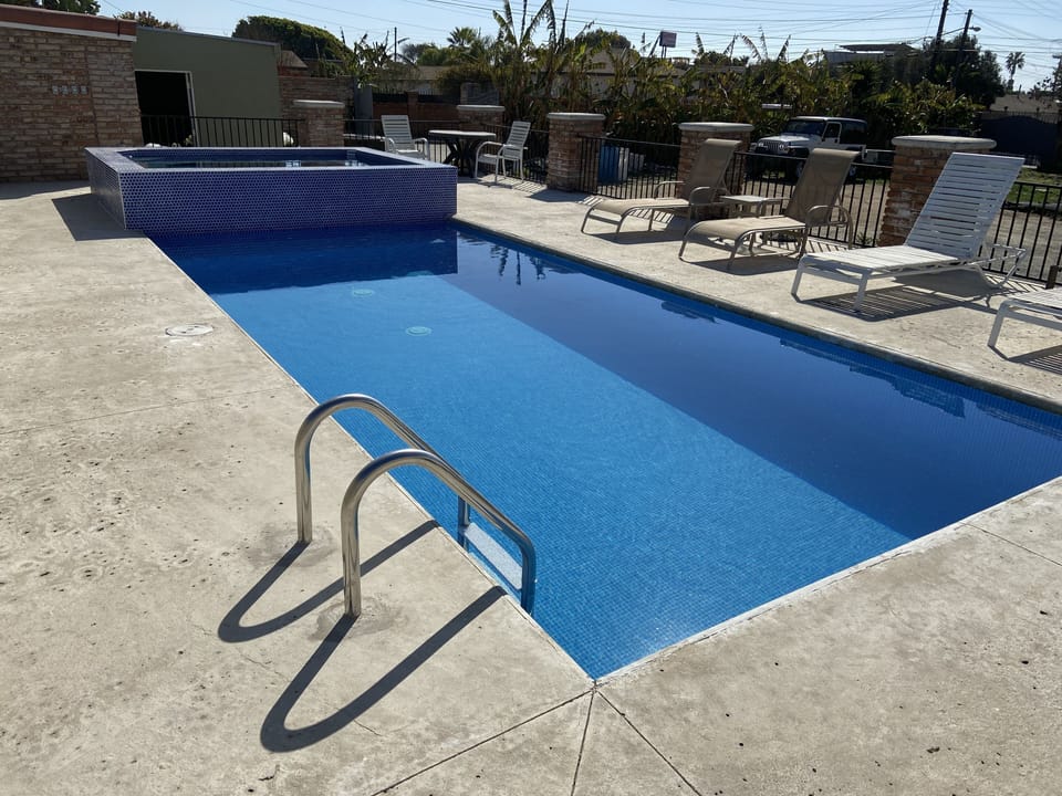 Elevated pool deck with safety fence 
