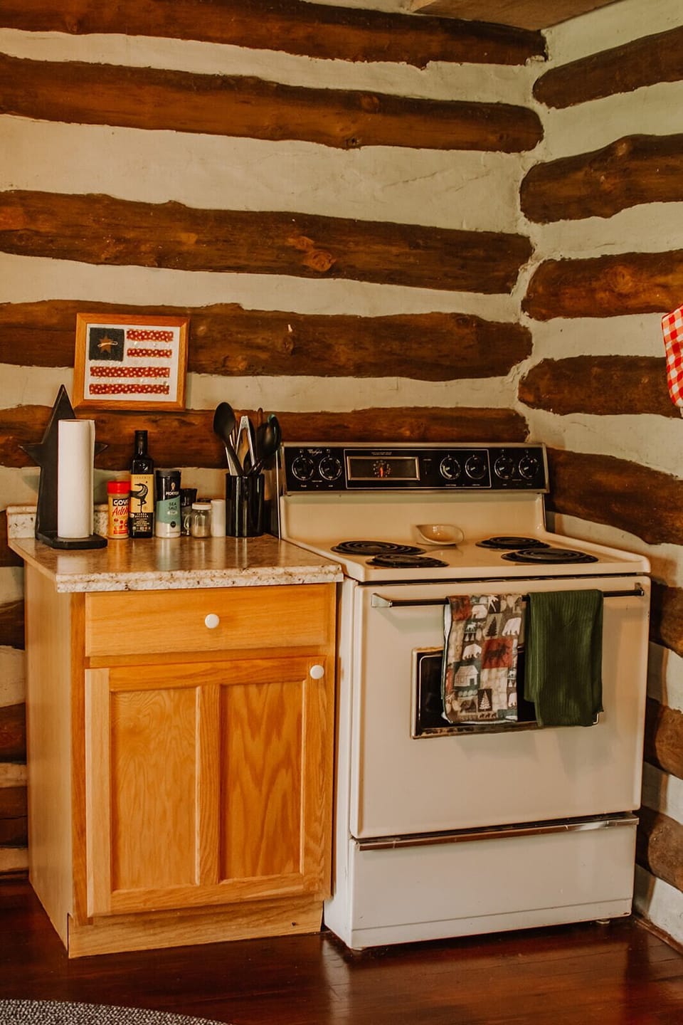 Full size stove and oven with plenty of cookware and utensils 