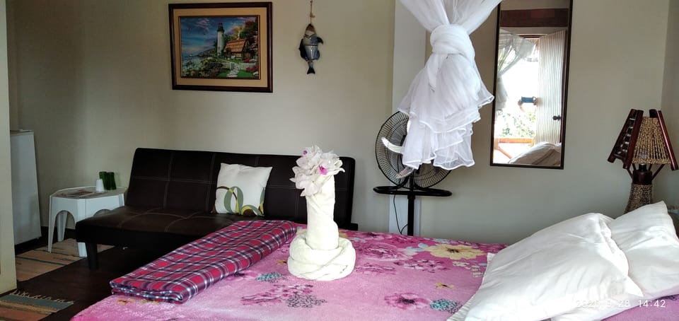 Romantic Suit with on  second floor overlooking swimming pool and garden.