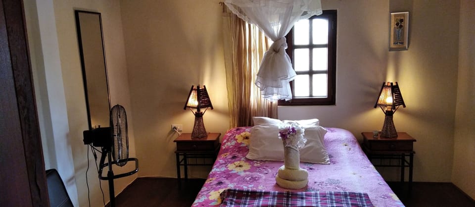 Romantic Suit with on  second floor overlooking swimming pool and garden.