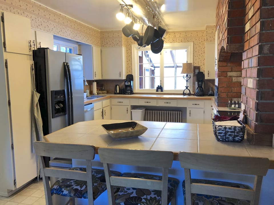 The kitchen has room for multiple cooks.  Views to the solarium, bay and hot 