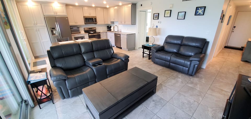 Open concept comfortable living and kitchen area 