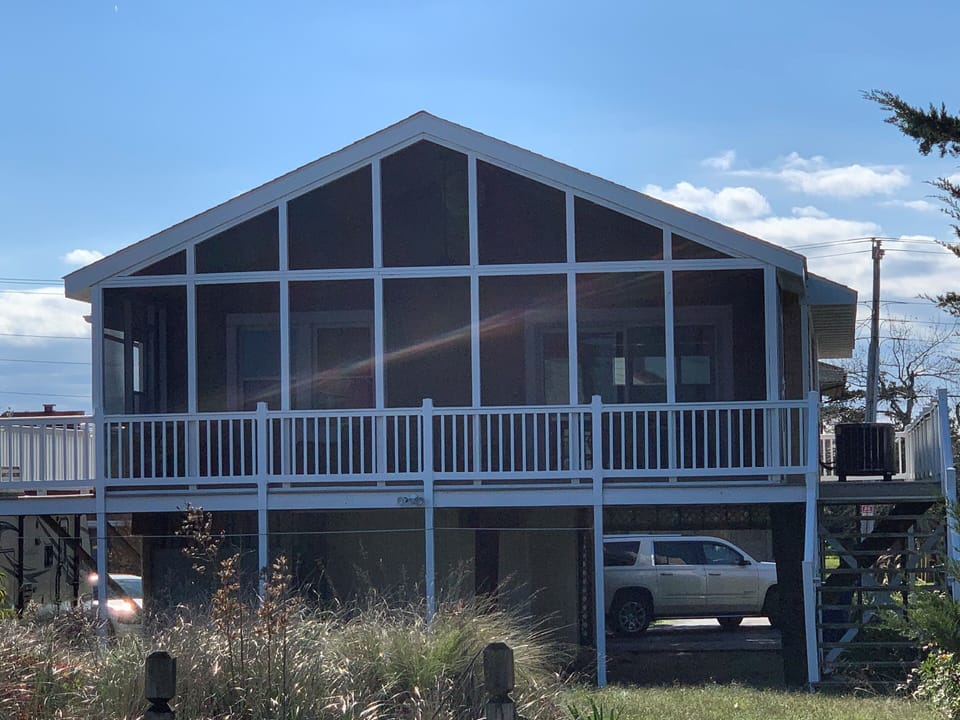 Screened porch overlooking the bay