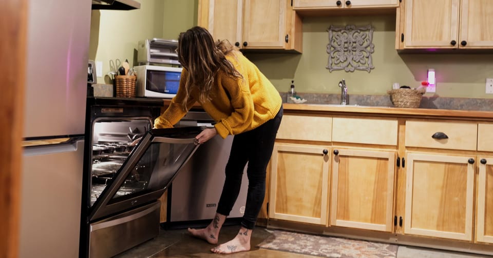 The kitchen is fully equipped with modern appliances, ample countertop space, and a well-stocked pantry, perfect for preparing delicious family meals.