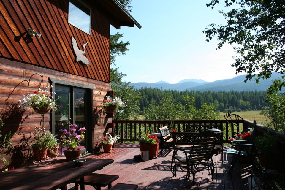 South deck overlooking ranch, creek, meadows and mountains to the East