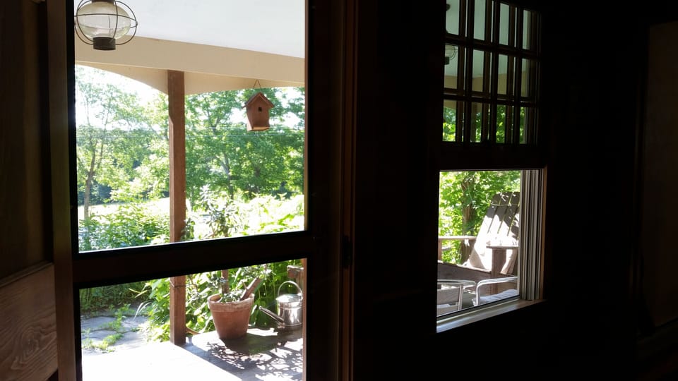 Sunny front porch is just off dining room. Lovely for morning coffee or tea.