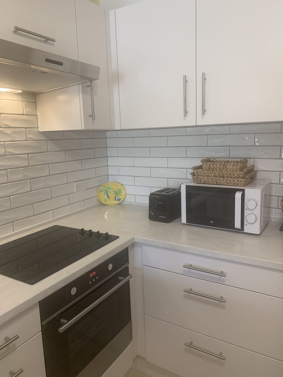 Newly updated kitchen in late 2022 with microwave, new cooktop, oven and toaster