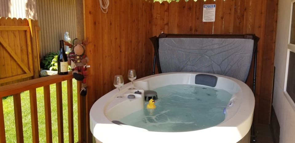 Sip some wine in your private 2 person hot tub Jacuzzi. 