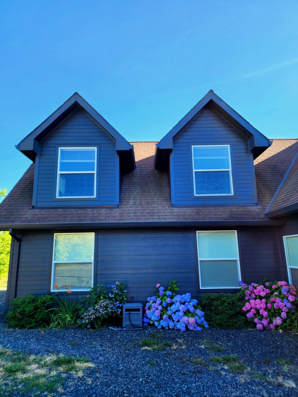 Exterior from driveway, rental is top floor and bottom left