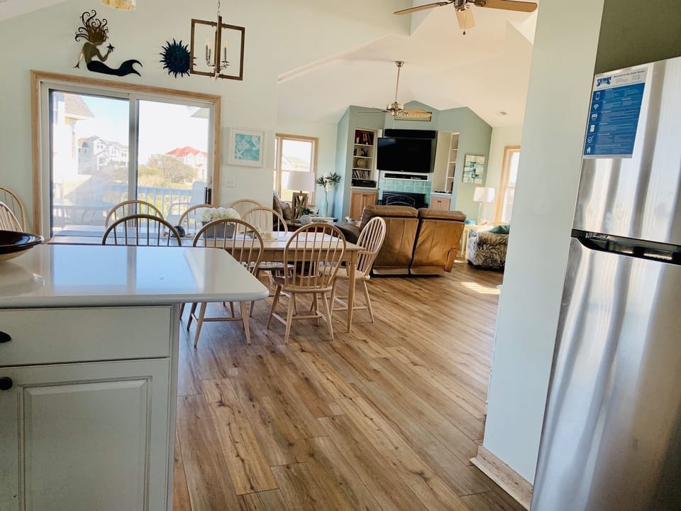 View from kitchen of dining and living areas. 