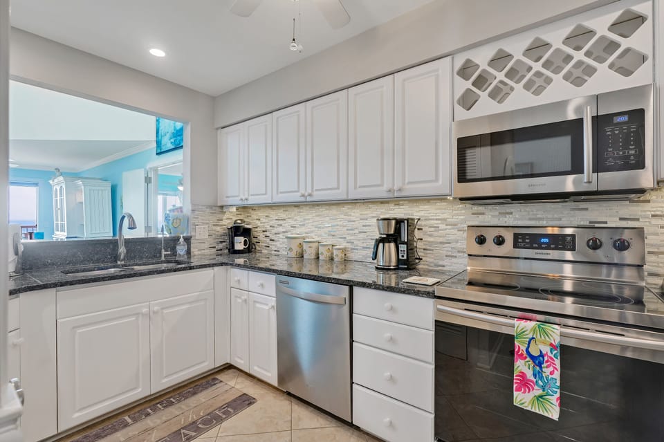 Granite countertops, stainless appliances, wine rack, reverse osmosis faucet