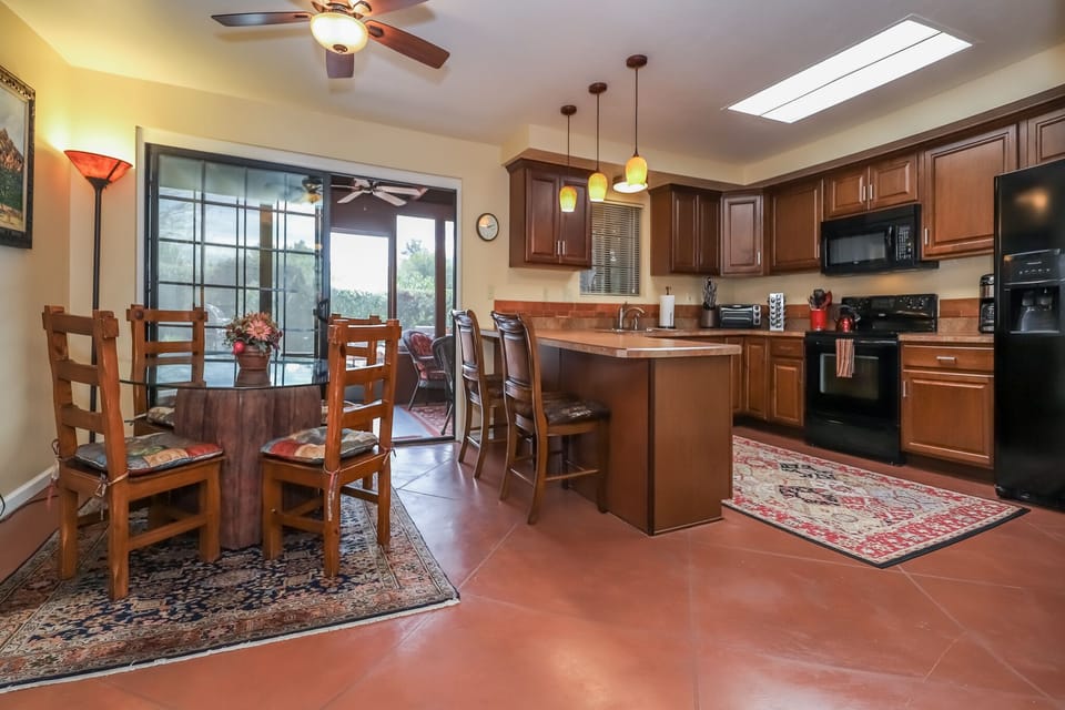 Open dining room and kitchen.  That is a sky light in the kitchen.