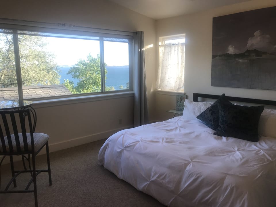 King bed in Master. Blue lake thru window 