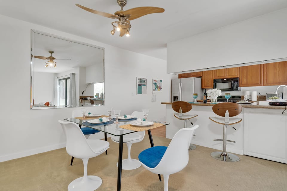 Dining table for four plus additional seating at countertop