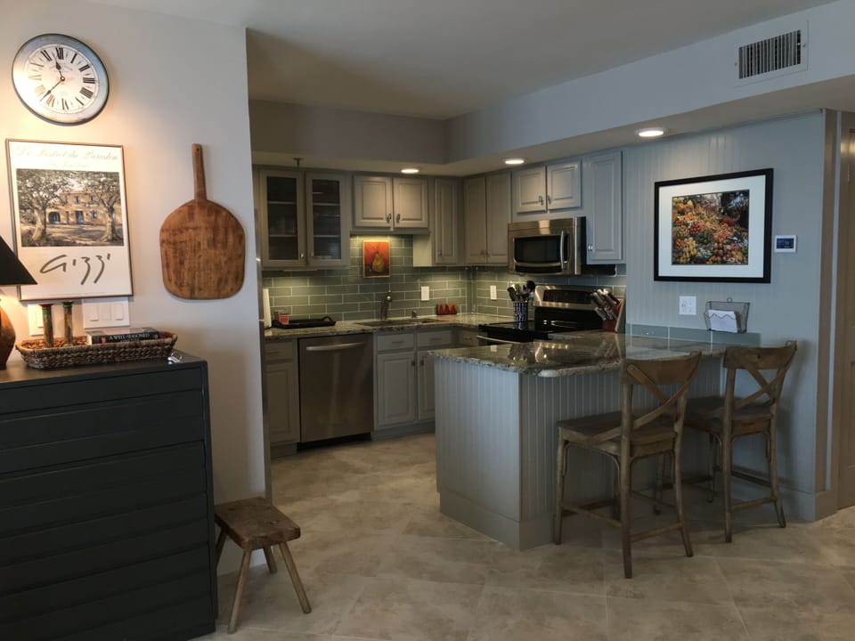 Renovated kitchen with granite counter top.