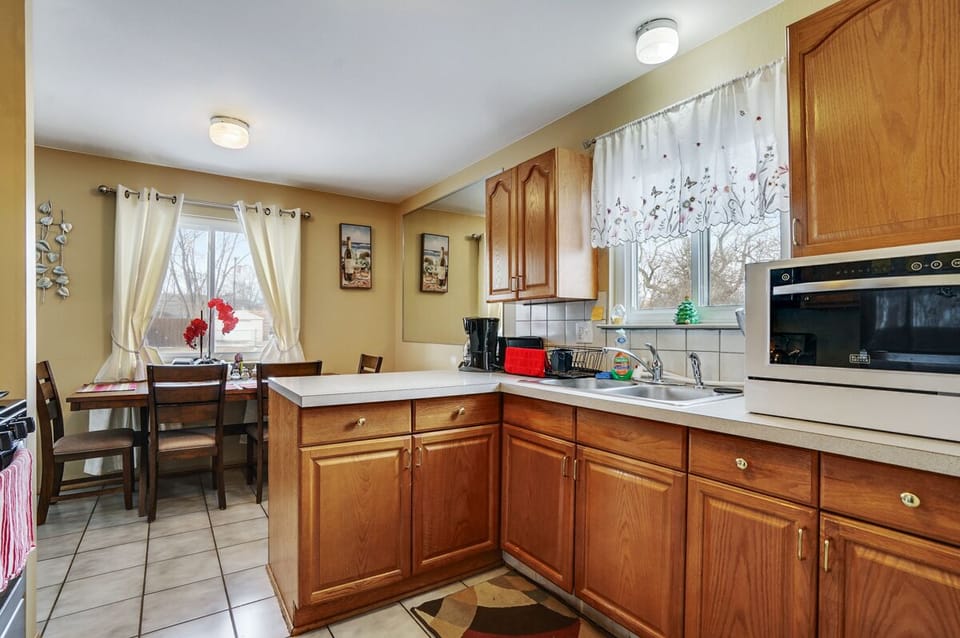 Nice kitchen with new Stainless Steel Samsung refrigerator, New stainless steel Whirlpool range and oven, two coffee makers ( one for ground coffee, another for kcup coffee), blender, toaster, kettle, microwave and kitchen wares