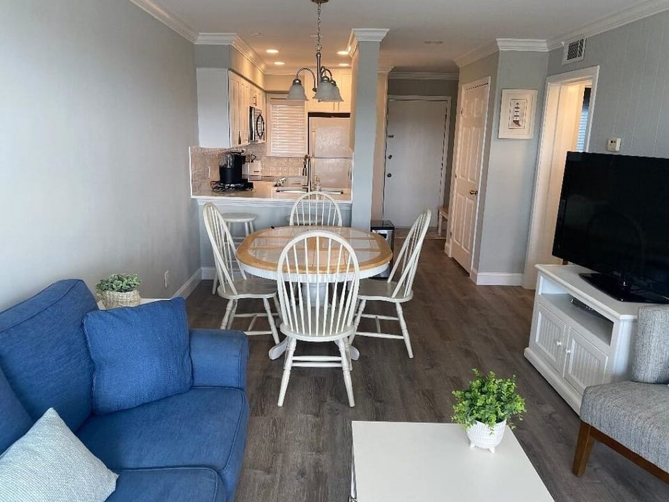 Living room with large screen tv with cable